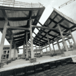 This is a large-span steel structure building under construction.