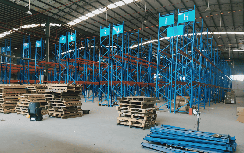 Light gauge steel shelving structures inside a warehouse.