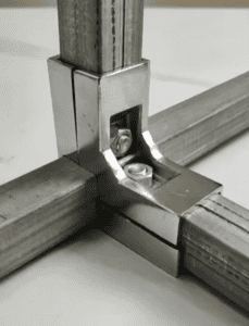 "Close-up of steel joint connections showing bolts and precise metal assembly for structural stability."