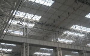 An overhead view of a steel grid structure used in a large - scale building.