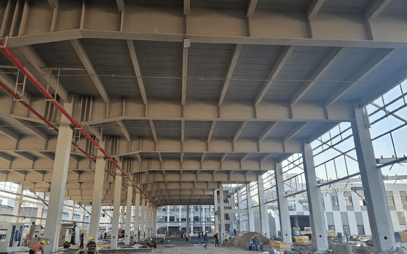 a construction site with steel purlins in the ceiling