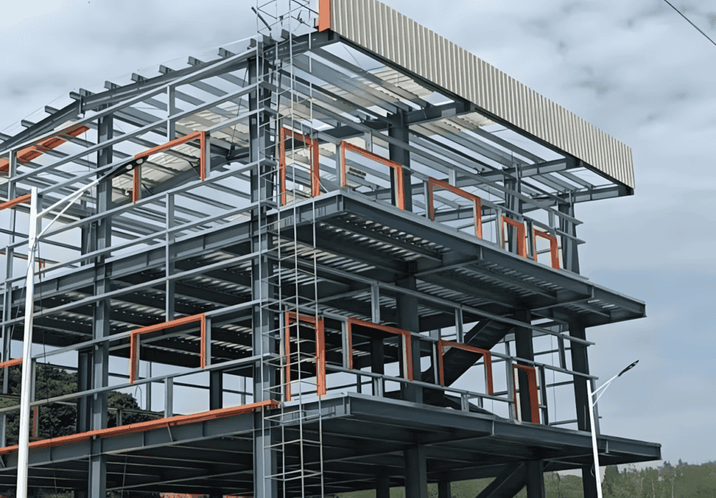 Exterior view of a partially completed Steel Structure Multi-Storey Building with a corrugated metal roof, orange framework accents, and open floor levels.