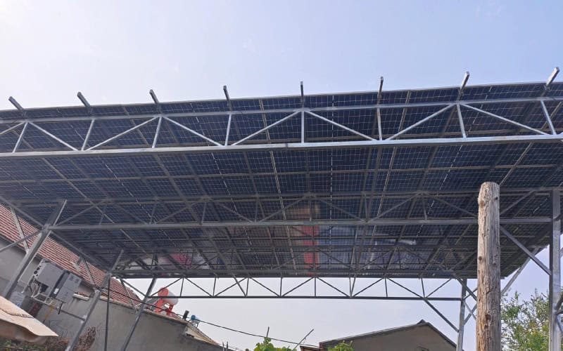 Actual steel roof truss structure with solar panels installed on top.