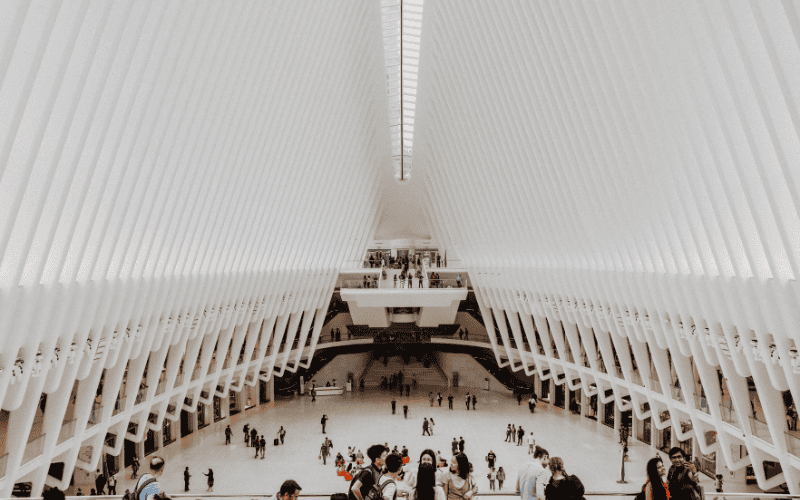  The interior of the World Trade Center's transportation hub in New York, featuring a futuristic design with its white, rib-like structures creating a dramatic and open space.