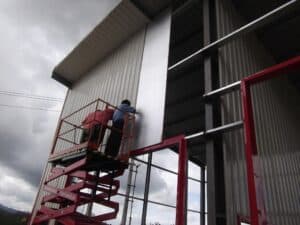 installing insulation panels on a steel building